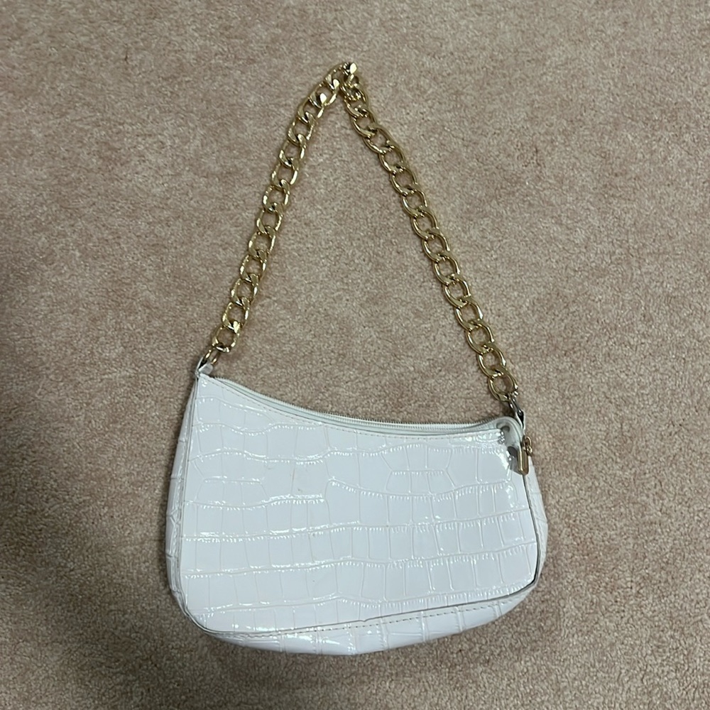 White purse with gold chain